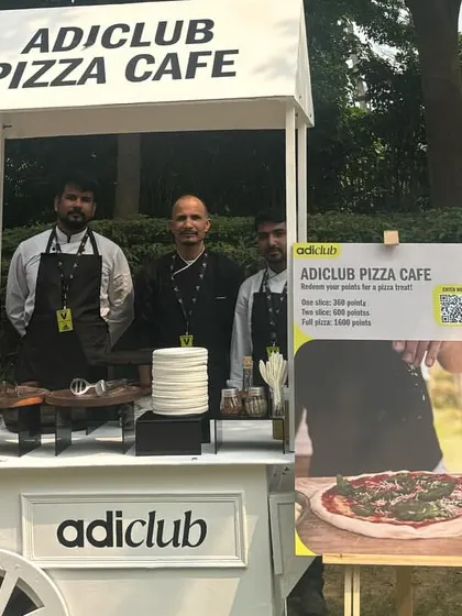 My team posing at the custom "adiclub Pizza Cafe" we set up for Adidas. We take pride in delivering a professional and memorable catering service for our corporate partners.