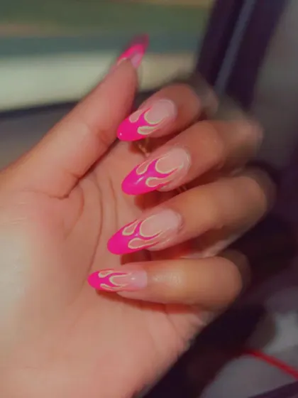 This set is on fire! We created this edgy look with bright pink flame outlines on a natural, sheer base for a design that's both hot and cool.