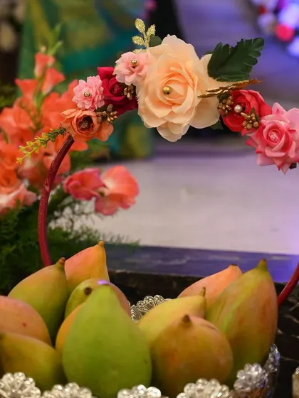 A similar fruit basket design, showing how I can customize the floral hoop to match your event's color scheme.