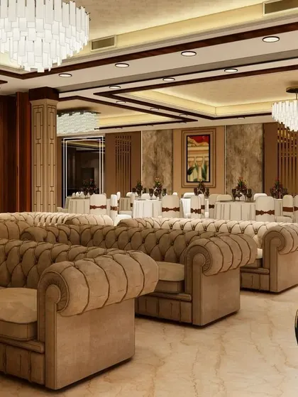 This render shows the interior lounge area for our upcoming banquet hall in Gorakhpur. We've used plush, tufted sofas and crystal chandeliers to create a luxurious and comfortable seating space for guests.