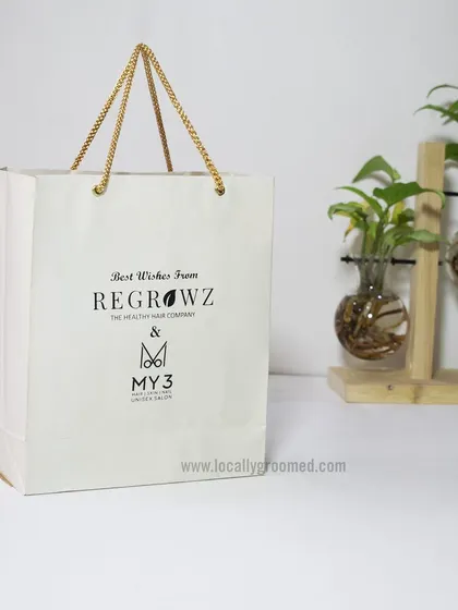 A closer look at the custom paper bag we created for Regrowz and My3. The minimalist design and sturdy rope handles provide a touch of luxury.