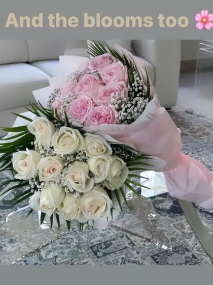 A classic and elegant choice. This picture shows two beautiful hand bouquets, one with pink roses and one with white, both mixed with delicate baby's breath.