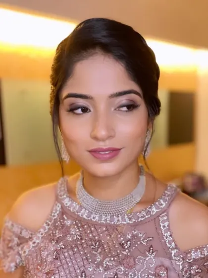 Dr. Sunayana looking elegant for her reception. I created a soft, diffused smokey eye and a mauve-pink lip to go with her beautiful gown.