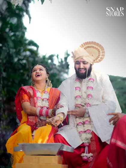 A moment of shared laughter during the wedding ceremony. Capturing these genuine, joyful expressions is a hallmark of our candid wedding photography style.