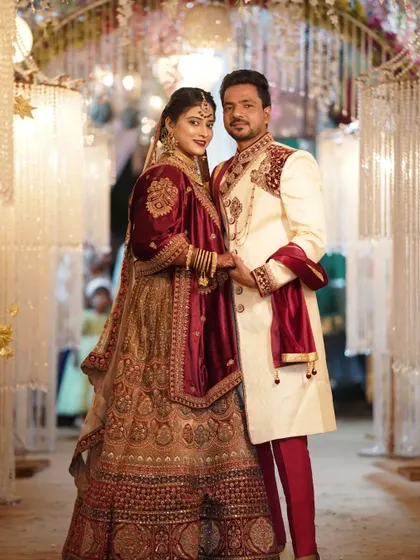 The couple looks confidently at the camera, a perfect formal portrait from their wedding reception.