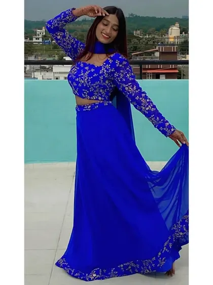 The flowing chiffon skirt and embroidered blouse make this blue lehenga both comfortable and stylish.