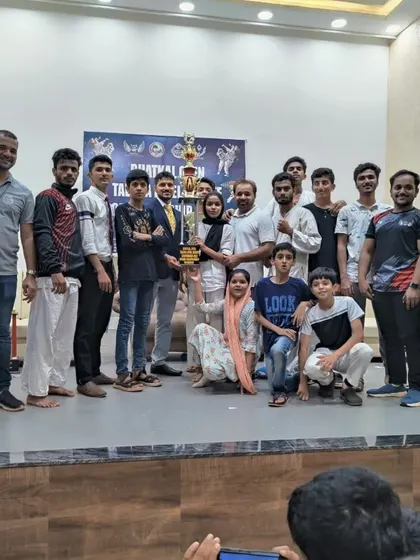 Another shot of the team celebrating with our champion, Shiza. We are a family that shares in each other's victories.