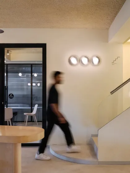 The transition upstairs, with clean lines and soft lighting creating a calm journey between floors.