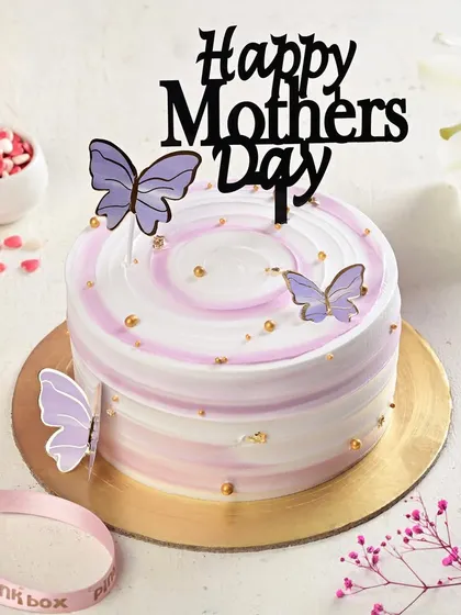 A lovely Mother's Day cake with a purple swirl design and delicate butterfly accents. The "Happy Mother's Day" topper makes it a perfect centerpiece for her special day.