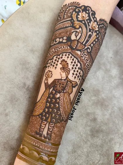 A close-up of the groom figure, showcasing the detailed work on his sherwani and turban. This is a perfect example of how I bring portraits to life in henna.