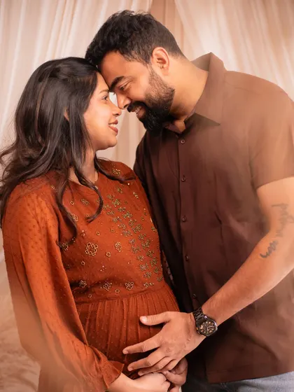 A close-up shot focusing on the intimate connection between the couple, their foreheads touching in a moment of shared love.