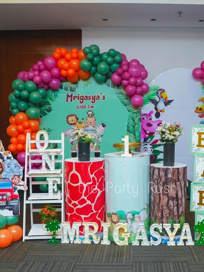 This full setup for Mrigasya's 'Wild One' party shows a wonderful combination of colorful balloons, animal cutouts, and themed props.