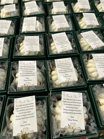 The final presentation of the braided candles, packed in our new hard boxes with custom 'Thank You' notes for a special event. This shows the full gifting experience.