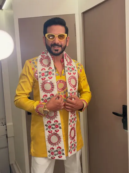 Backstage and ready to go for a Garba night in a vibrant yellow kurta. The outfit sets the mood before I even step on stage.