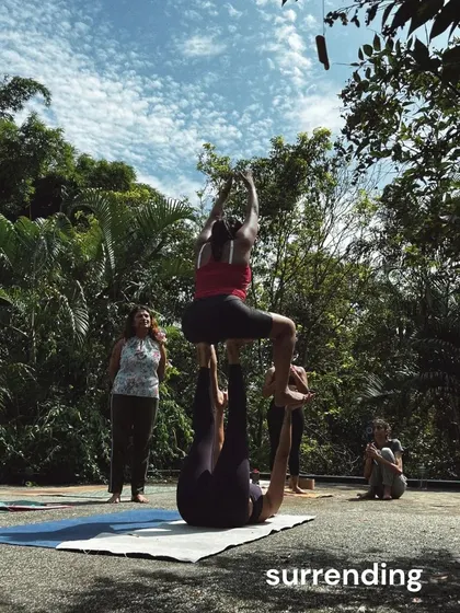 Surrendering into the pose and trusting your partner. Acro Yoga at our retreats is a beautiful dance of giving and receiving support, set against the backdrop of nature.