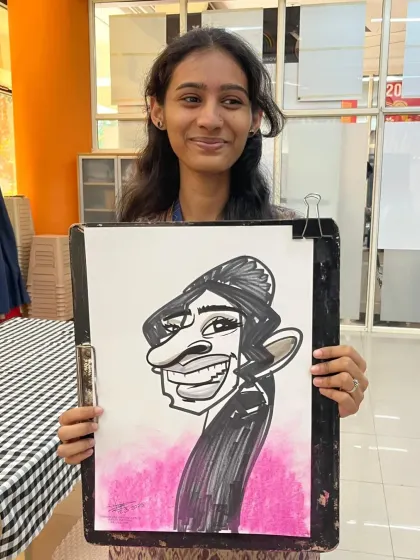 The pink background adds a nice touch to this caricature, matching the fun and celebratory mood of the day.