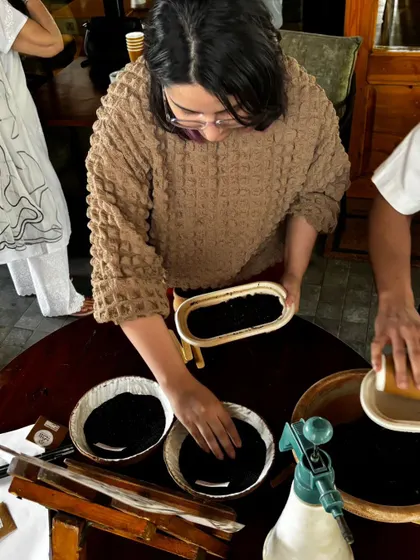 A participant carefully sowing seeds. Learning to grow food is a skill that empowers you to live a healthier and more sustainable life.