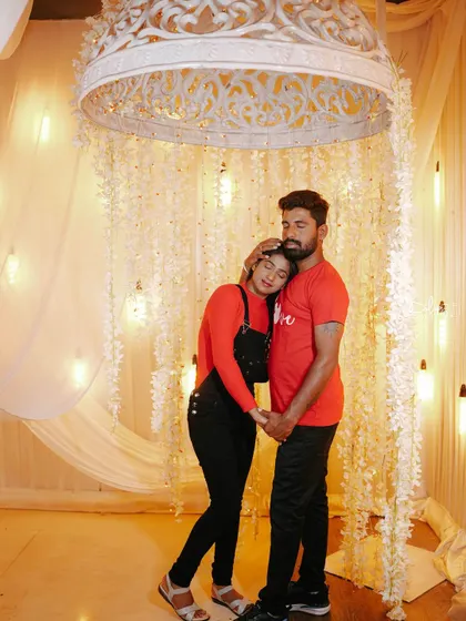 A tender moment under the same floral canopy, perfect for a romantic and dreamy photoshoot.