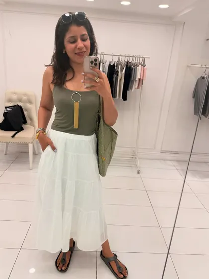 Another one of my looks from May. An olive green tank top with a statement necklace paired with a tiered white skirt is a great combo for a warm day.