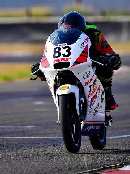 A head-on shot of Siddesh on his Pro Stock 165-200cc race bike, focused on the track ahead.