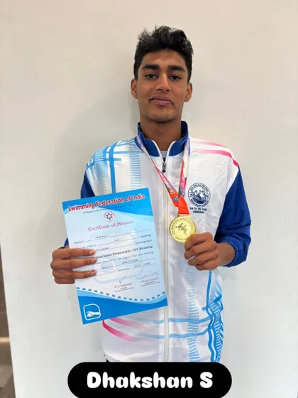 Dhakshan S with his gold medal for the 200m Freestyle.