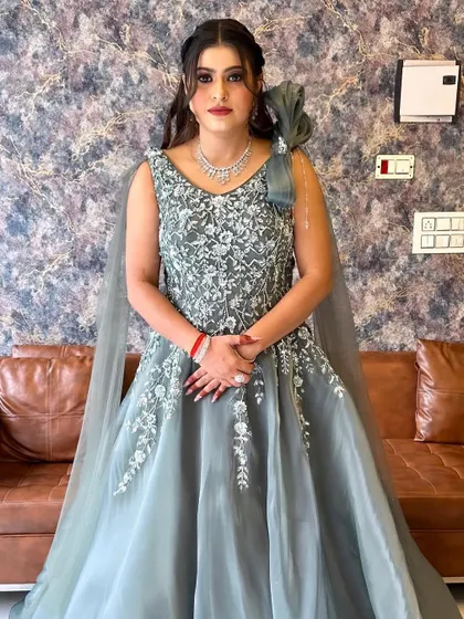 A full view of this stunning engagement gown. The intricate silver embroidery on the bodice is the star of the show.
