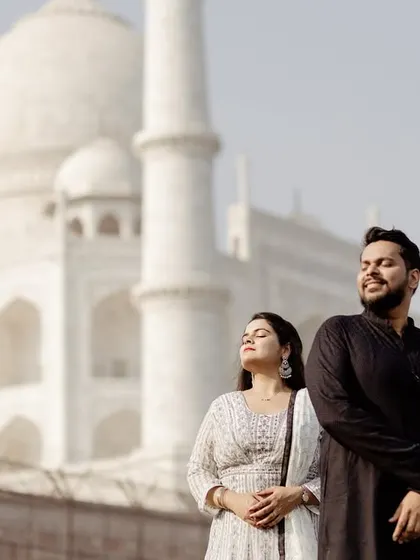 A sun-kissed candid moment, showing the couple enjoying the warmth and beauty of the location. Natural light is key to creating these warm, genuine portraits.