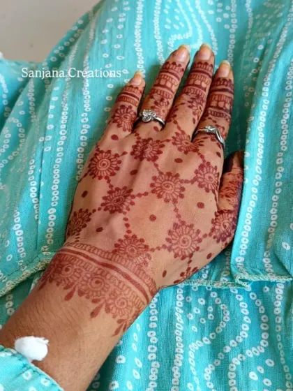 The stain of a delicate net and floral design, showing a beautiful light orange colour in its initial stage.