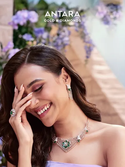 As she steps into her moment, the Pride of the Bride collection lets her shine brilliantly. Her story is woven into this stunning emerald and diamond necklace set.