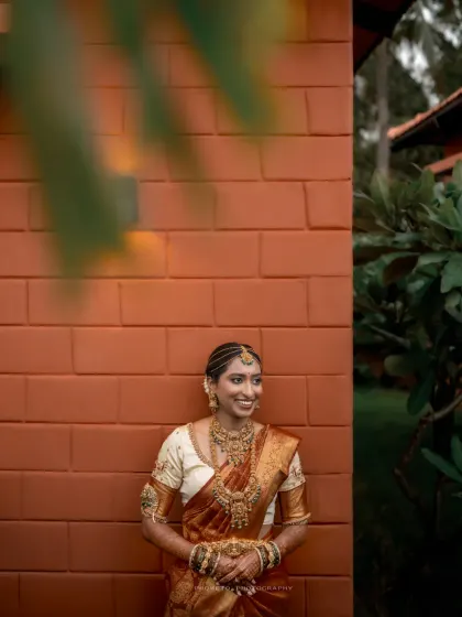 A beautiful solo portrait of the bride, her smile radiant as she enjoys a quiet moment.