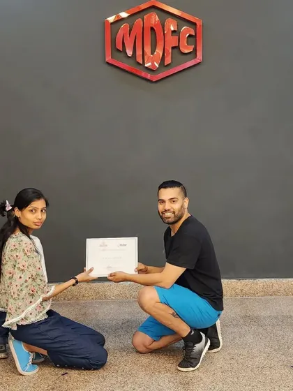 Presenting a certificate to one of our adult students, celebrating her dedication on International Dance Day.