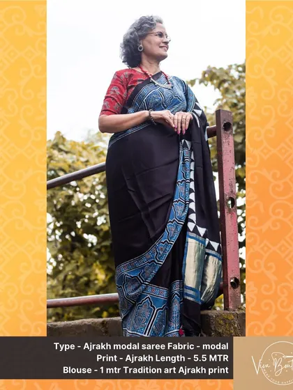 A full view of our black Ajrakh modal saree with a blue printed pallu and a subtle zari border. It’s a perfect example of modern design meeting traditional craft.
