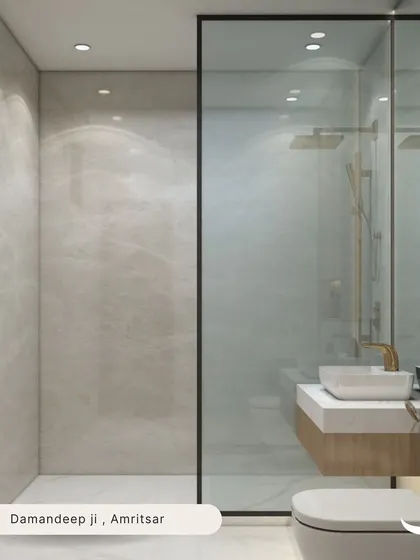Another view of the clean and modern bathroom for Damandeep in Amritsar, showcasing the glass shower partition and the wood-finish vanity with integrated lighting.