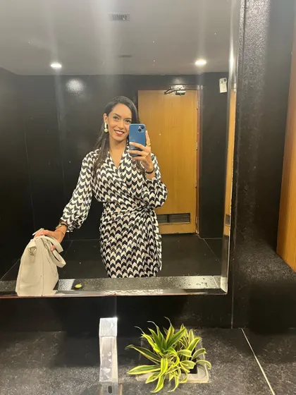 A quick mirror selfie before heading out for a gig. It's all about feeling confident and ready to command the stage.