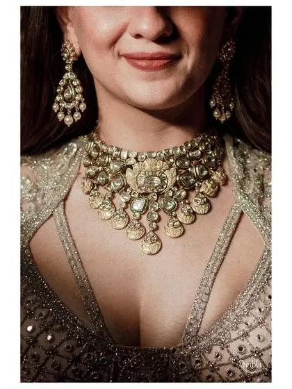 A detailed shot of the bride's stunning polki necklace, highlighting the exquisite craftsmanship of her wedding jewelry.