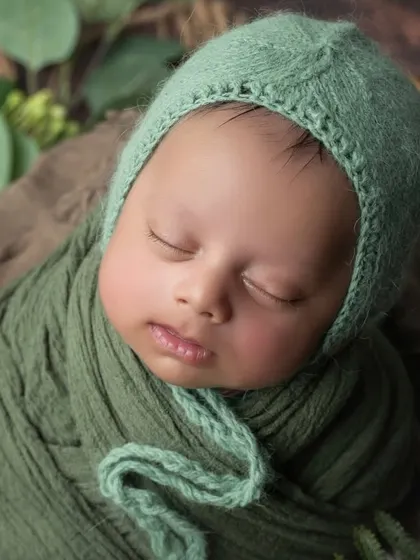 A slightly different angle, capturing the soft light on his cheek. These close-ups are essential in every newborn session.