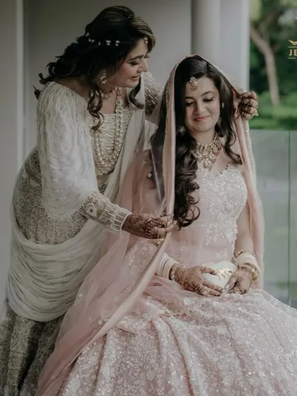 A beautiful moment between mother and daughter, as the bride is adorned with our timeless Polki jewellery for her wedding day.