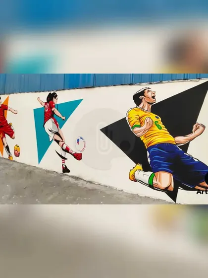 Another part of the football mural, showcasing players in celebratory poses. The artwork captures the peak moments of excitement in the game.