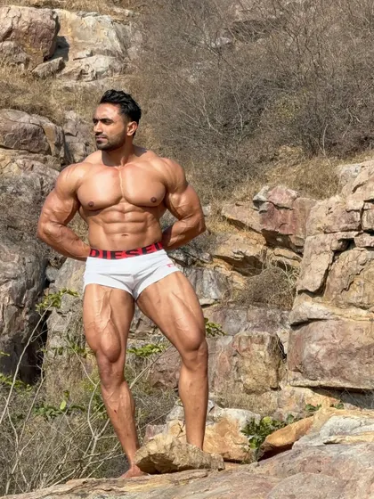 Out of station. An outdoor photoshoot in a rocky landscape, showing my physique in natural light.