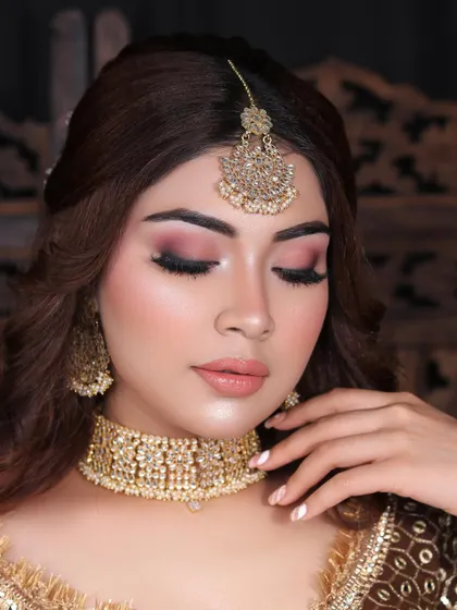 A flawless engagement look with soft pink smokey eyes and a nude lip, perfect for a sophisticated evening event.
