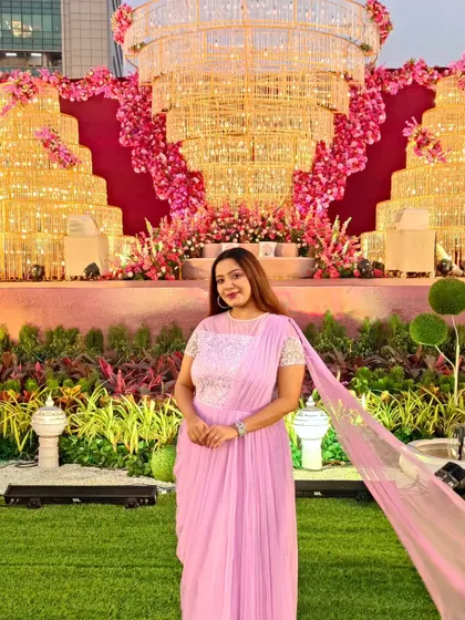 Showcasing a beautiful lavender saree-drape gown at a grand wedding venue. I believe in sustainable fashion and love restyling my outfits to create fresh looks for different events.