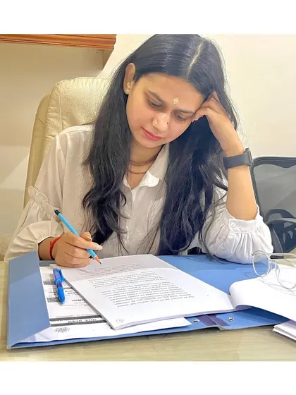 The work of a lawyer is in the details. Here, I am meticulously reviewing case files and drafting documents, ensuring every argument is solid and every fact is accounted for in your defense.