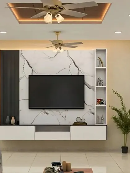 This entertainment center features a dramatic black and white marble-effect panel. The floating white console and side shelving provide ample storage, creating a bold and contemporary focal point.