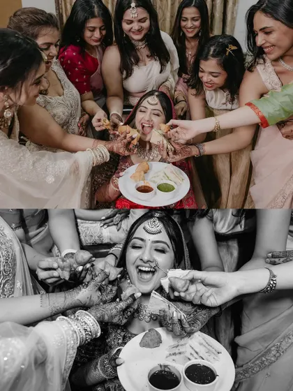 A fun and candid moment where the bride is playfully fed by all her bridesmaids, a perfect capture of their bond.