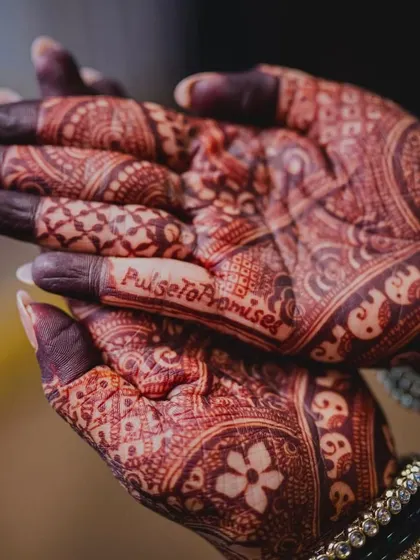 This bride, a doctor, chose the hashtag "PulseToPromises." We incorporated it right into her intricate bridal mehendi, blending her profession with her new journey.
