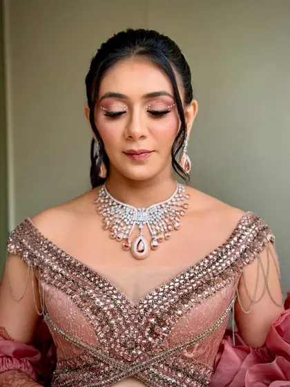A dramatic and creative look for a carnival-themed party, with a statement pink gown and bold eye makeup.