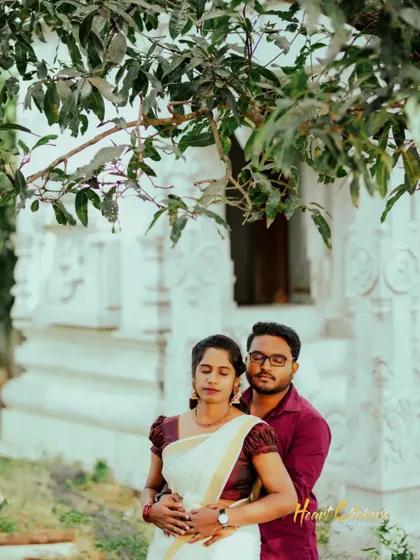 A duplicate of ID 84, this shot captures a moment of quiet intimacy with a traditional white building in the background.