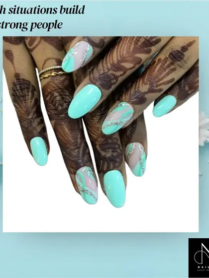 This design combines a soft turquoise gel polish with a silver glitter wave pattern on an almond-shaped nail. Our courses cover gel application, color theory, and how to create unique designs that complement elements like henna.