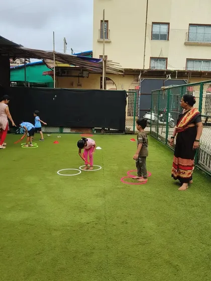 Hoops on the ground create perfect targets for jumping in and out of. This activity is excellent for improving agility, balance, and coordination in a playful, structured way.