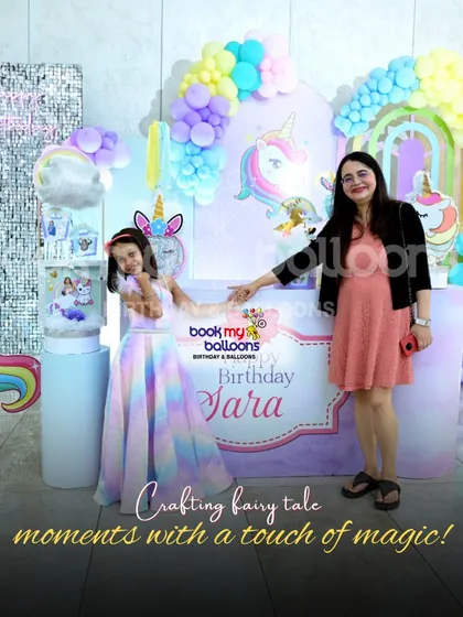 This image from Tashi's unicorn party shows how we craft fairy tale moments with a touch of magic. The happy family photo in front of our elaborate decor is what it's all about.